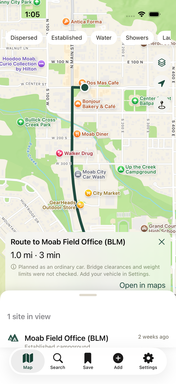 A planned route drawn on the map with distance, travel time, and a note about vehicle dimensions.